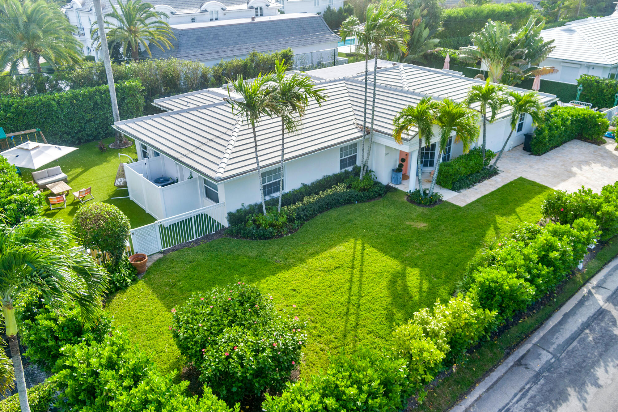 a view of a house with a yard and garden