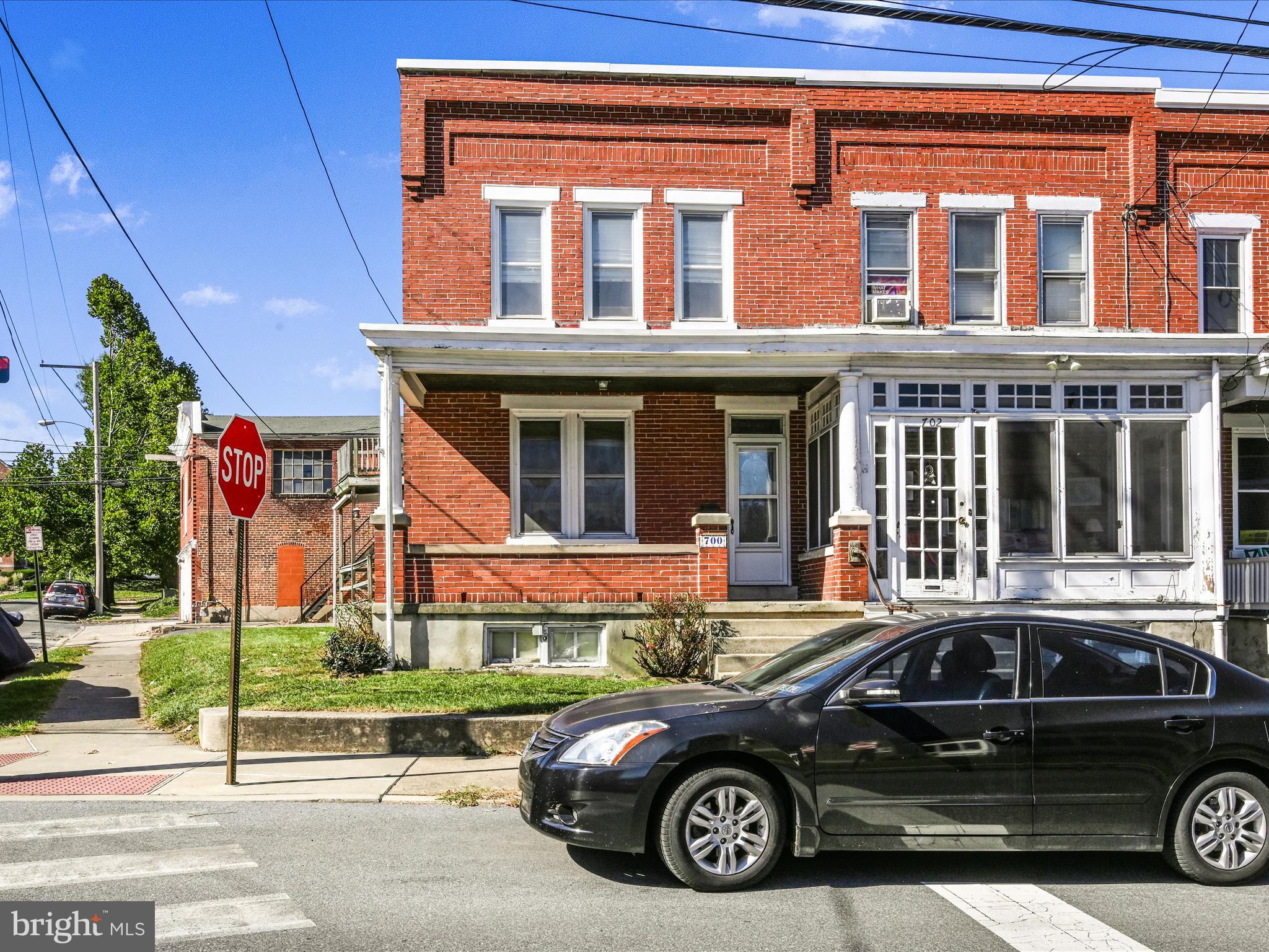 a car parked in front of a house