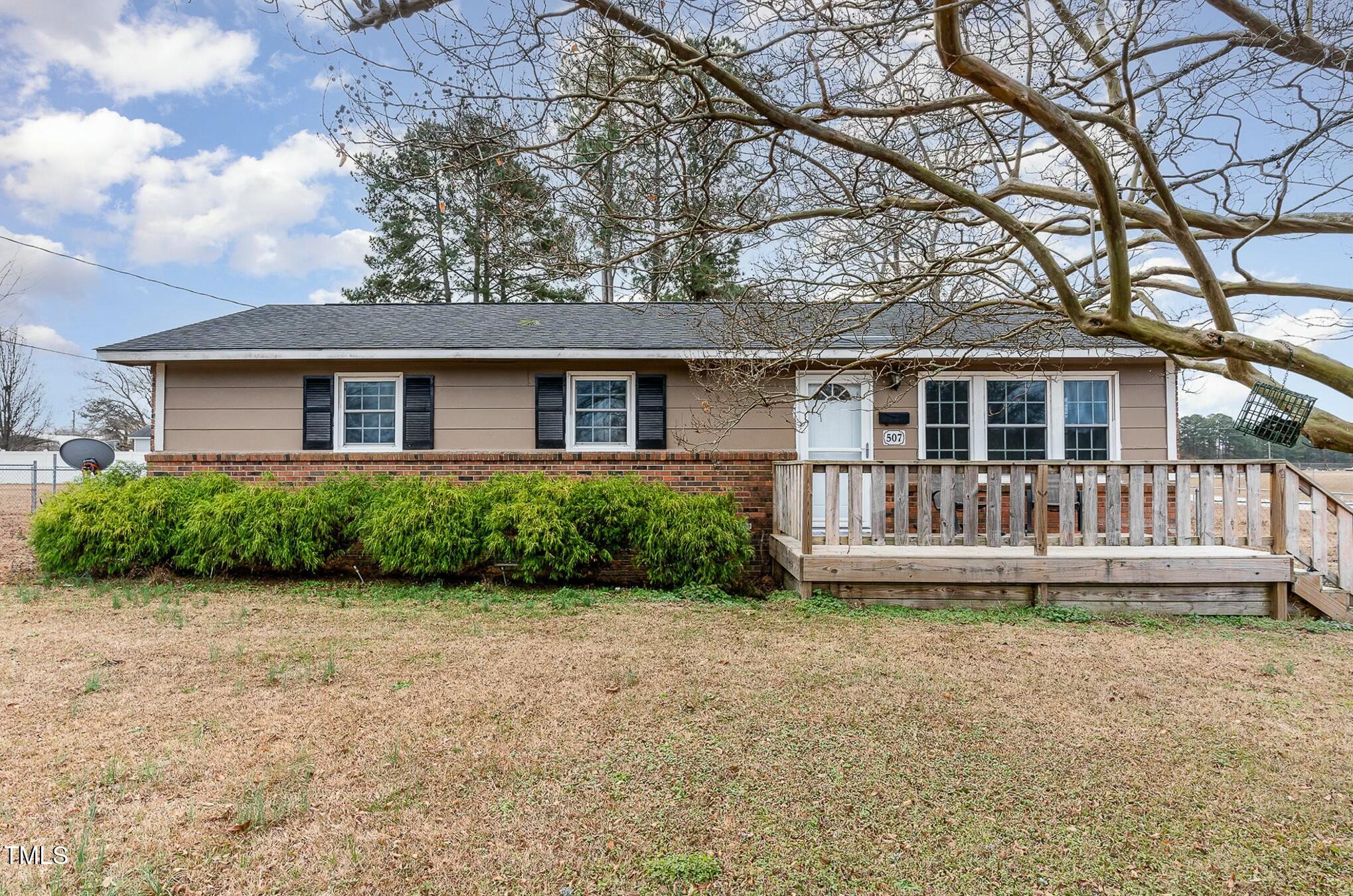 front view of a house with a yard