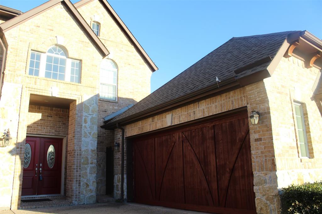 a view of a house with a door and wooden walls