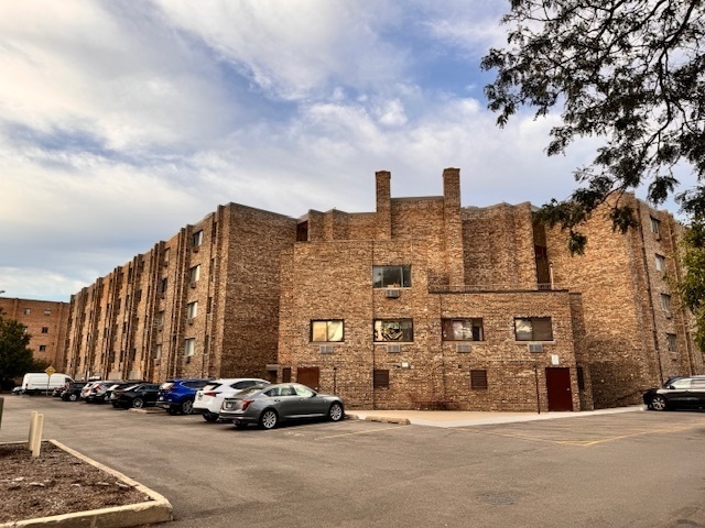 a buildings with a sink and a car parked in front of it