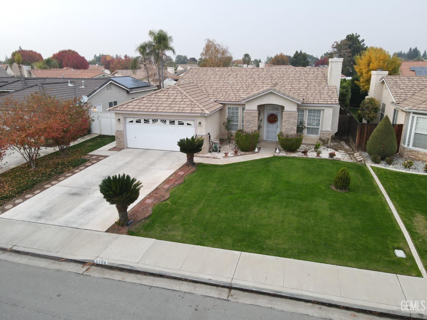 a front view of house with yard and green space