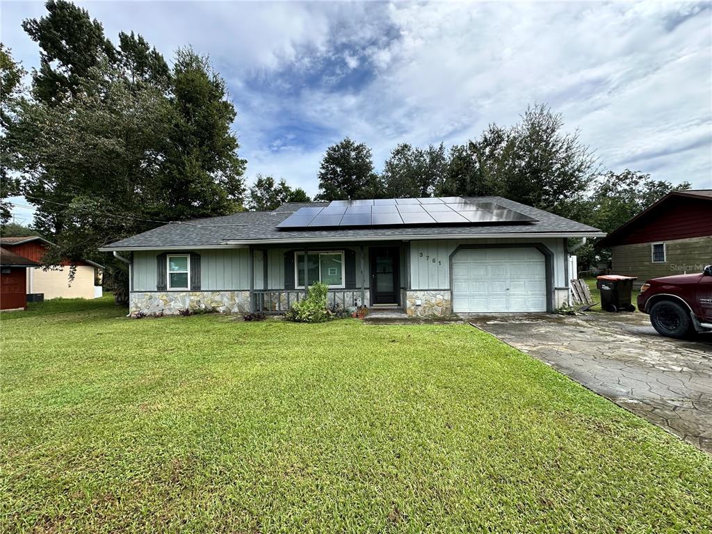 a view of a house with a yard