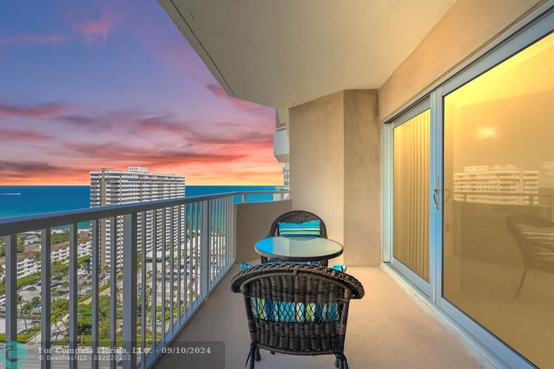 a view of balcony with furniture