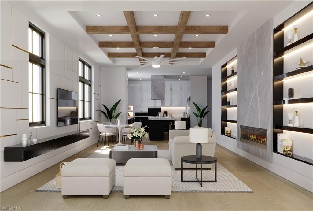 a living room with furniture kitchen view and a large window