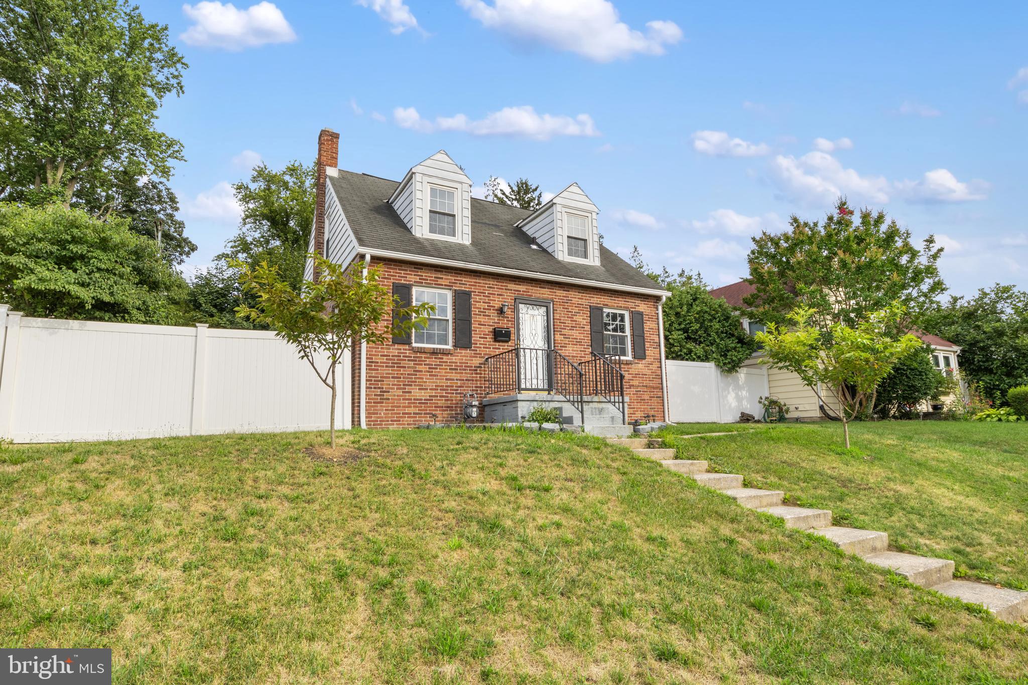 a view of front of house with a yard