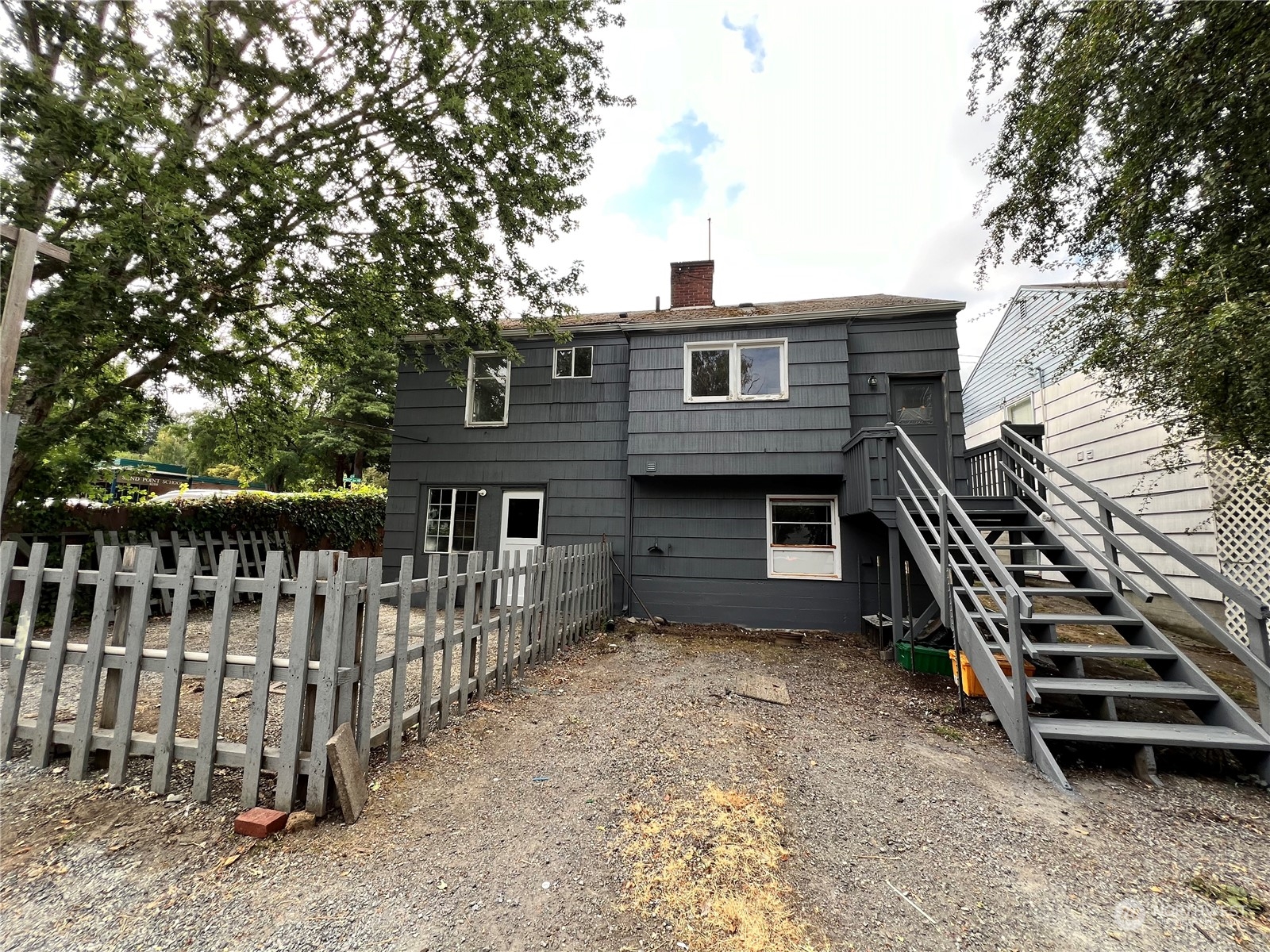 a front view of a house with parking space