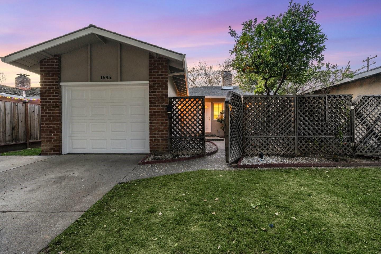 a front view of a house with a garage