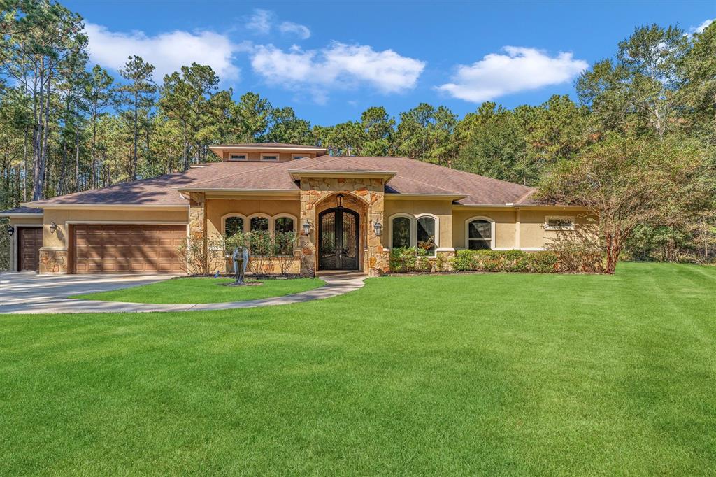 a view of house with backyard