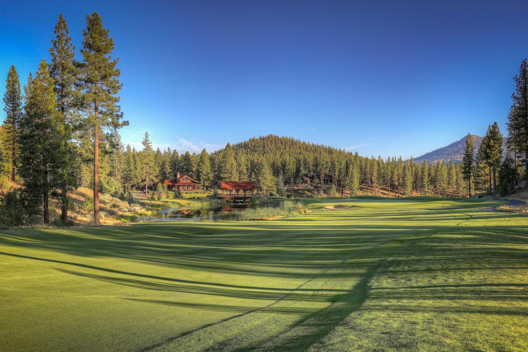 a view of a golf course with a lake