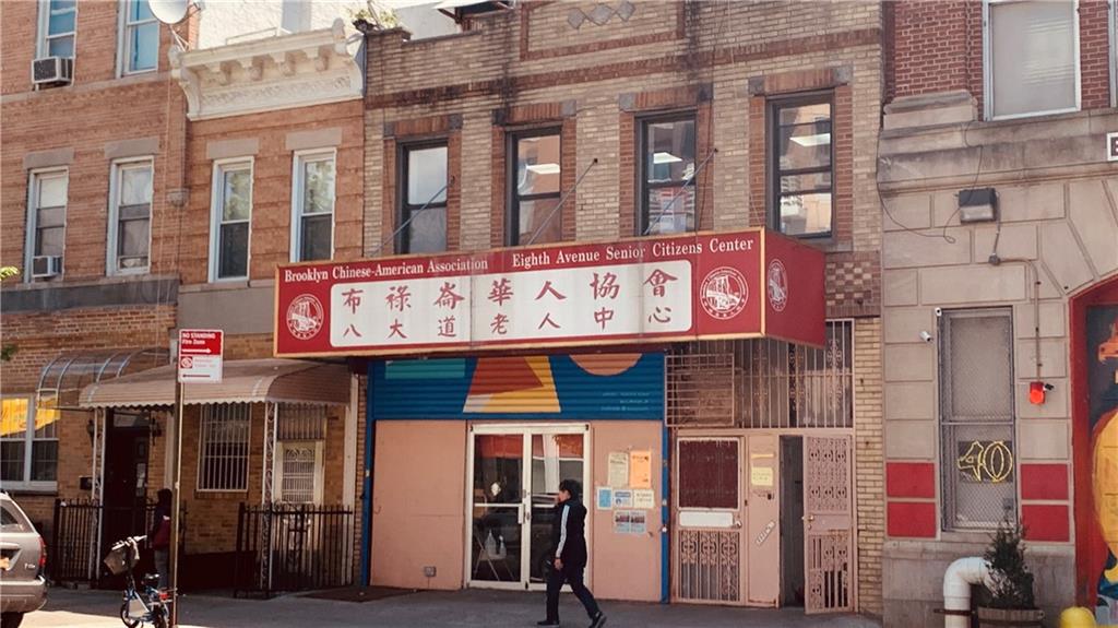 a view of a building with retail shops