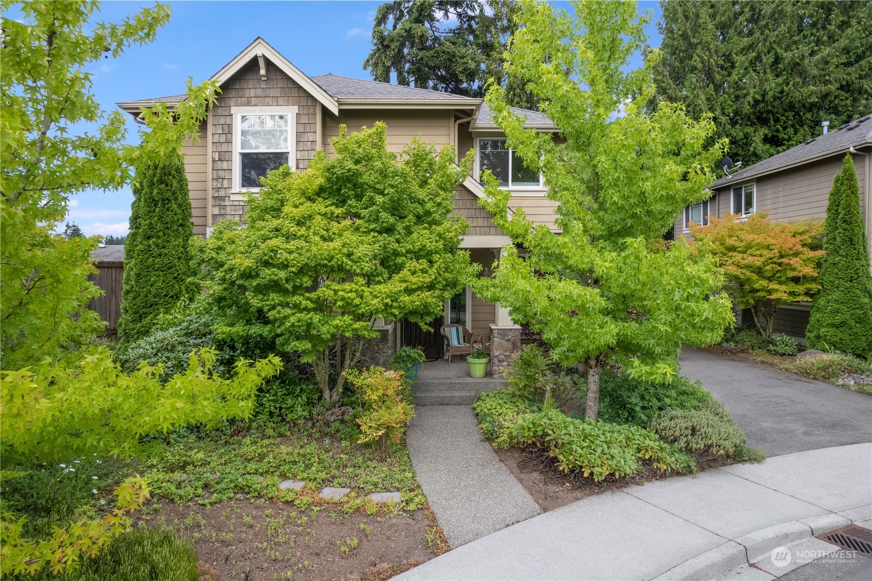 a front view of a house with garden