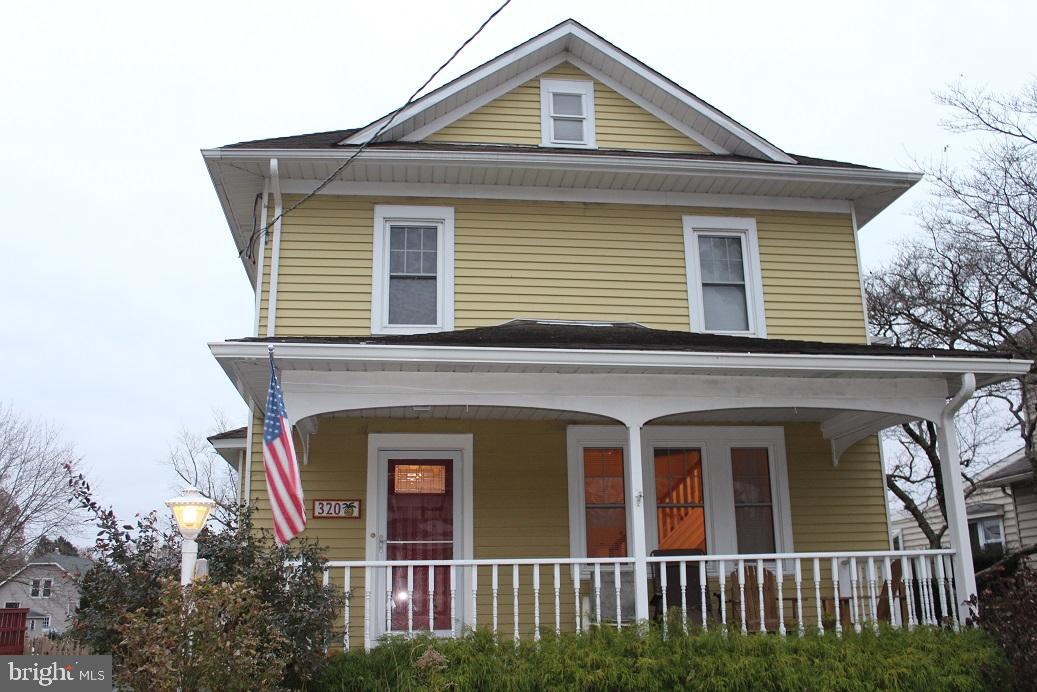 a front view of a house with a porch