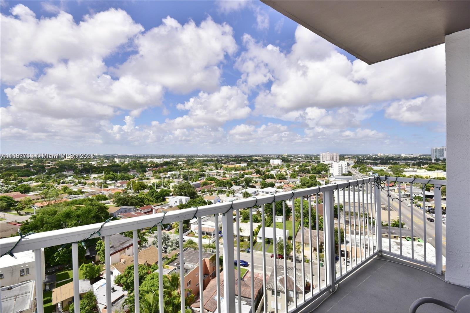 a view of a balcony with city view