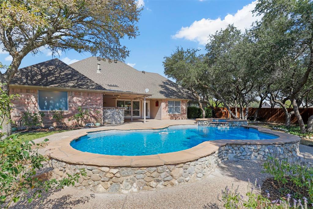 a view of pool with outdoor seating