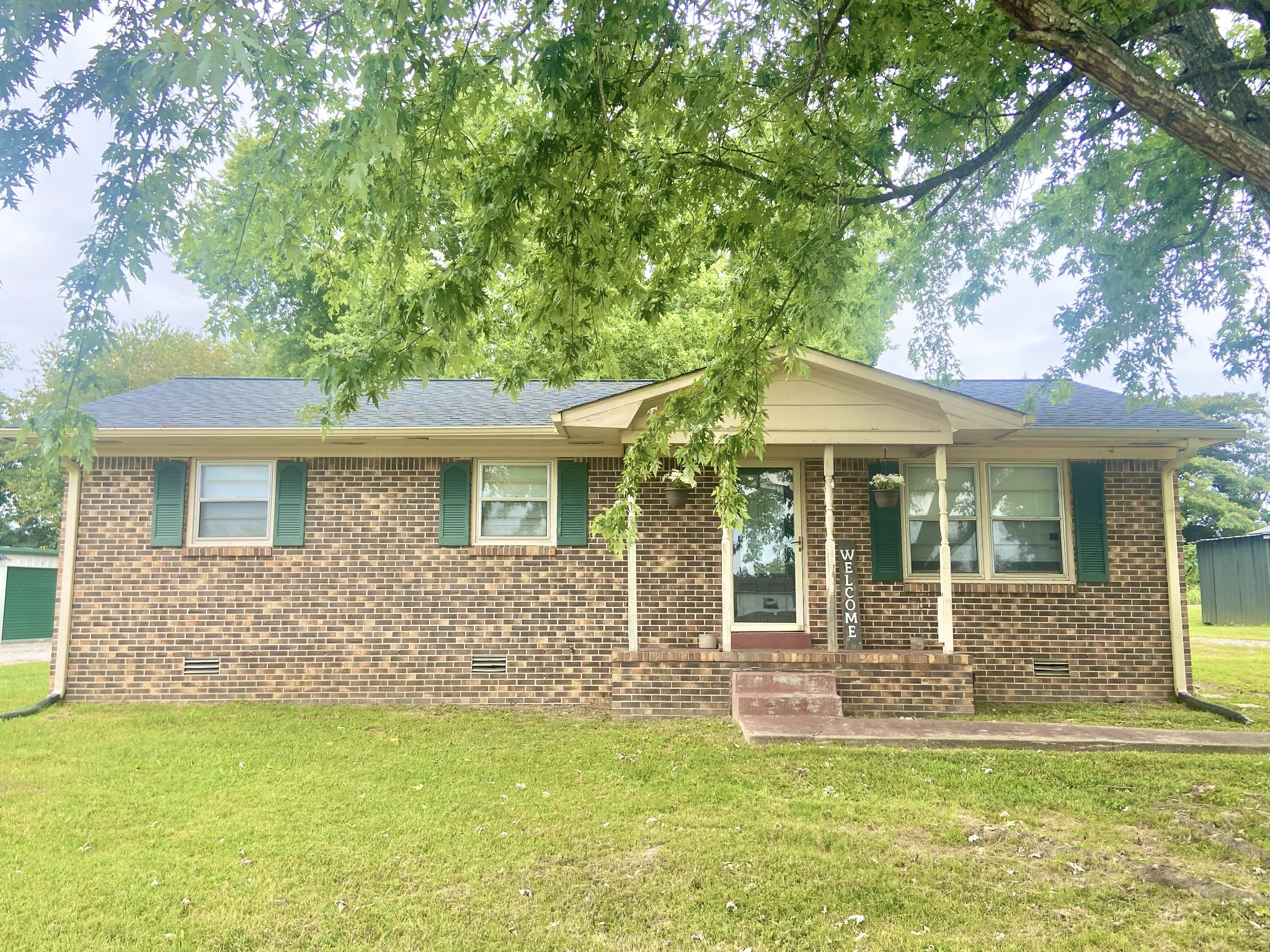 a front view of a house with a yard