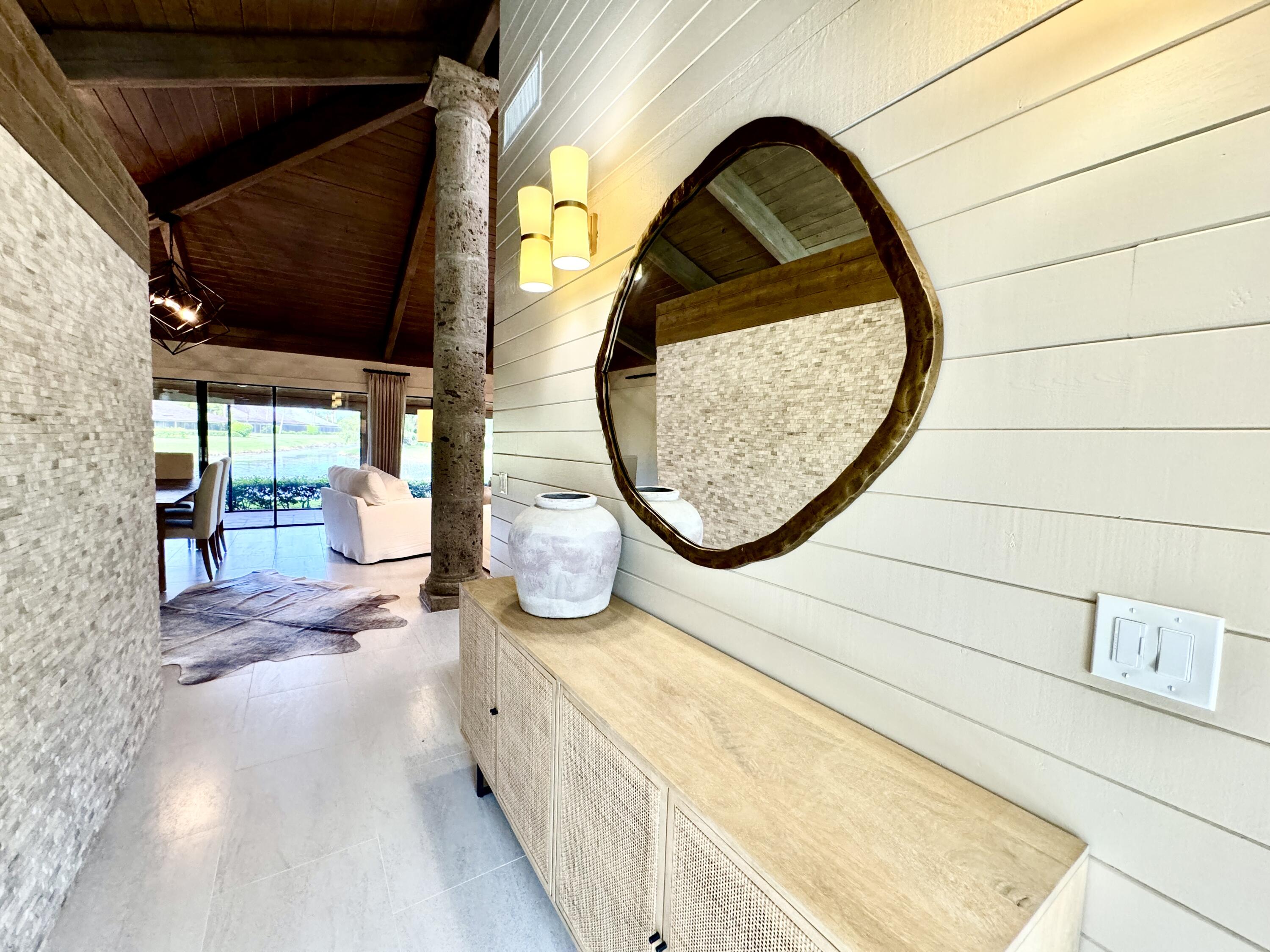 a view of swimming pool from a bathroom