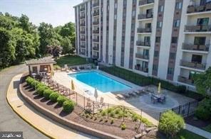 a view of a swimming pool with a patio