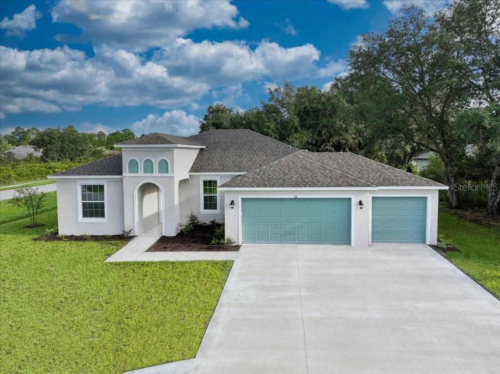 a front view of house with yard and green space