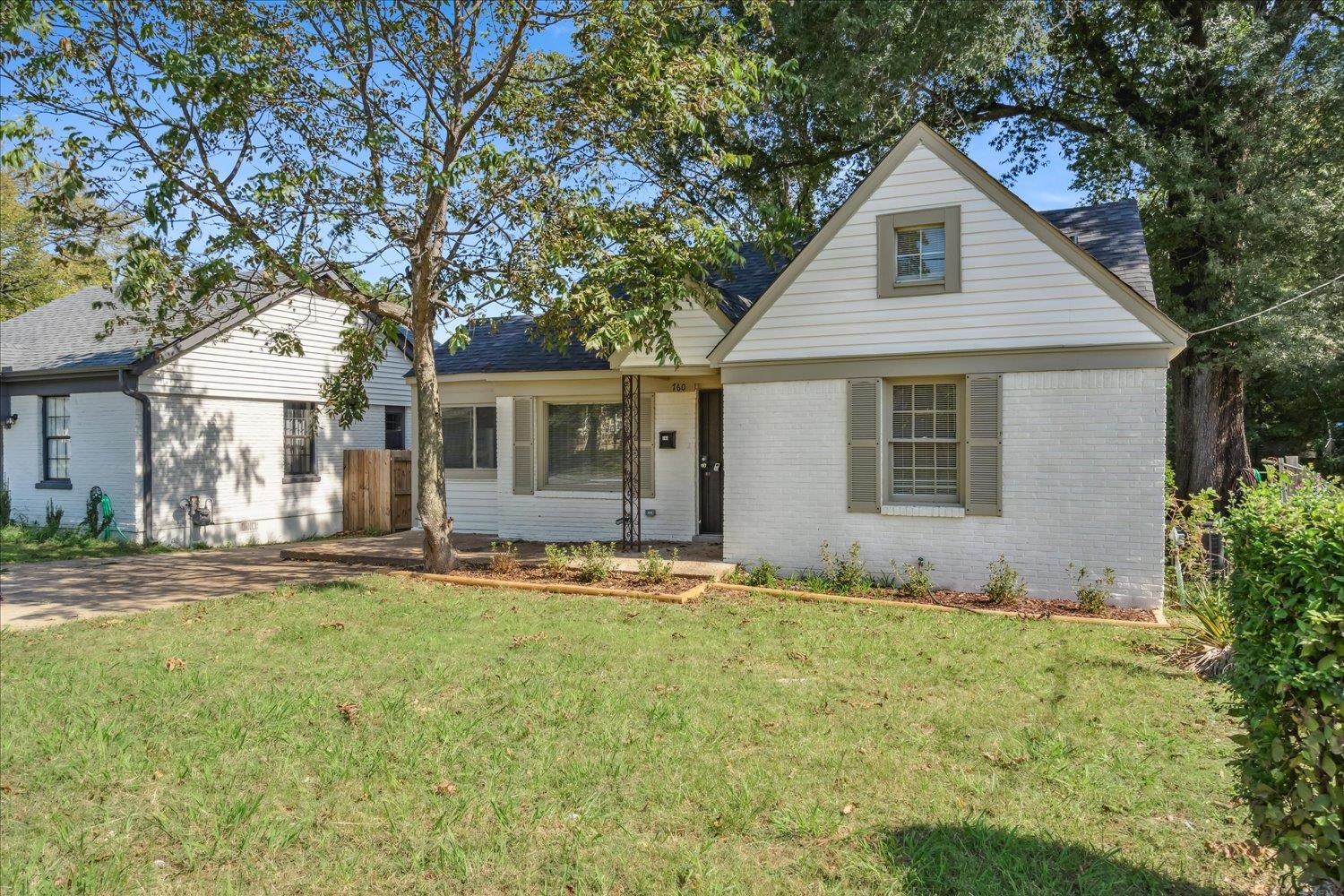 View of front of house with a front yard