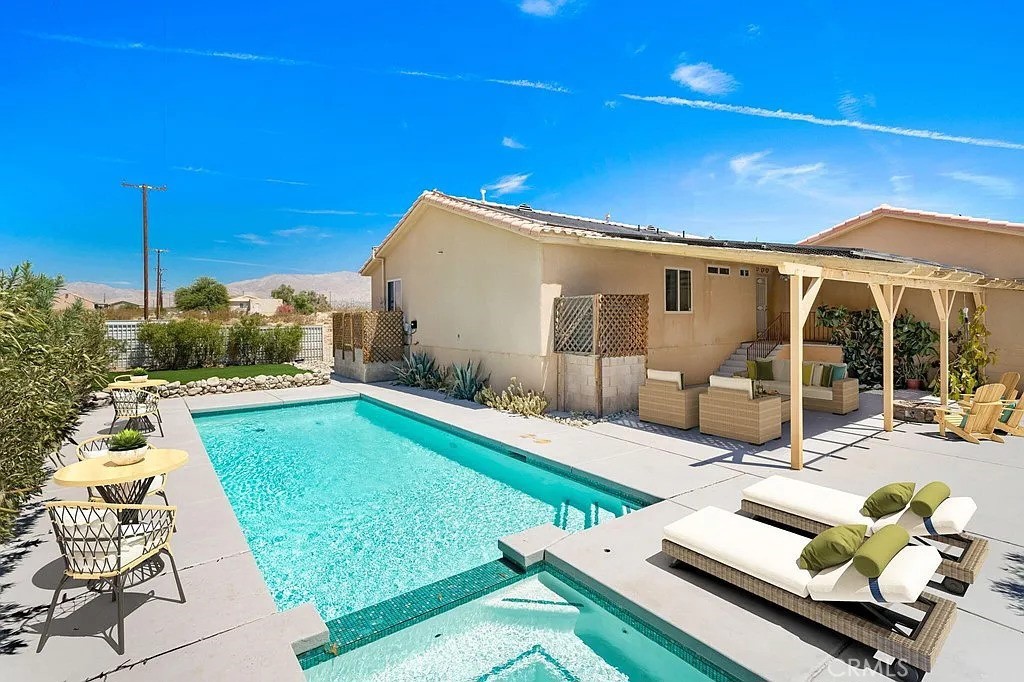 a view of a swimming pool with a patio