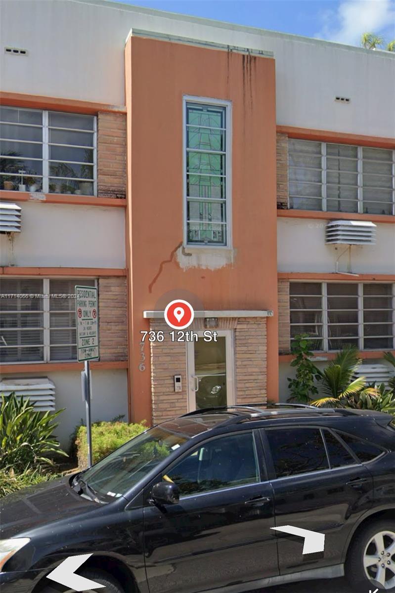 a car parked in front of a building