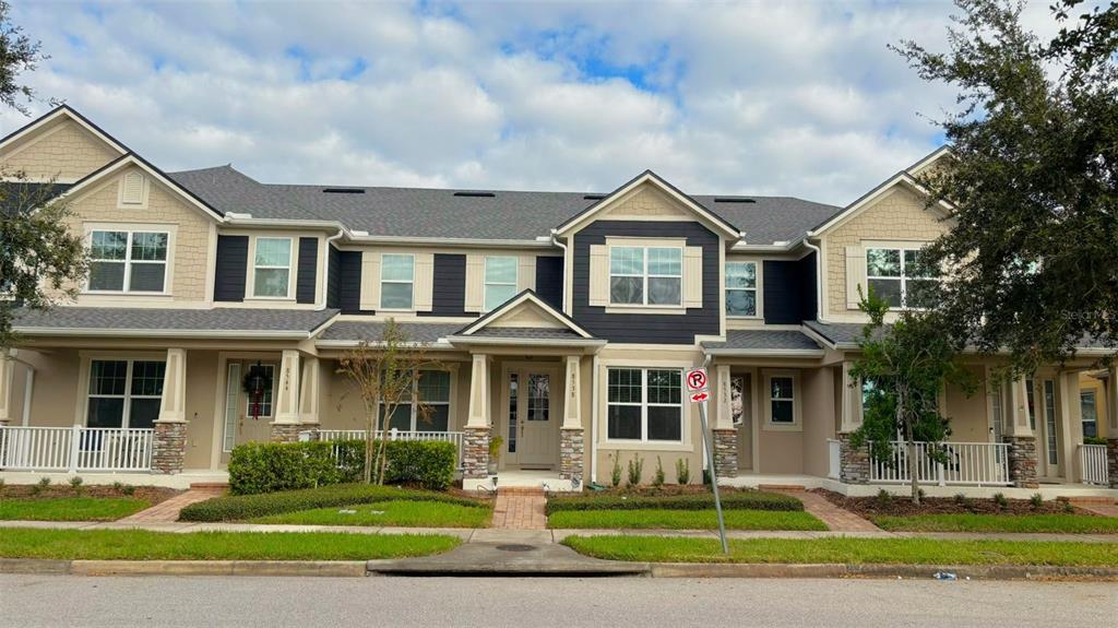 a front view of a house with a yard