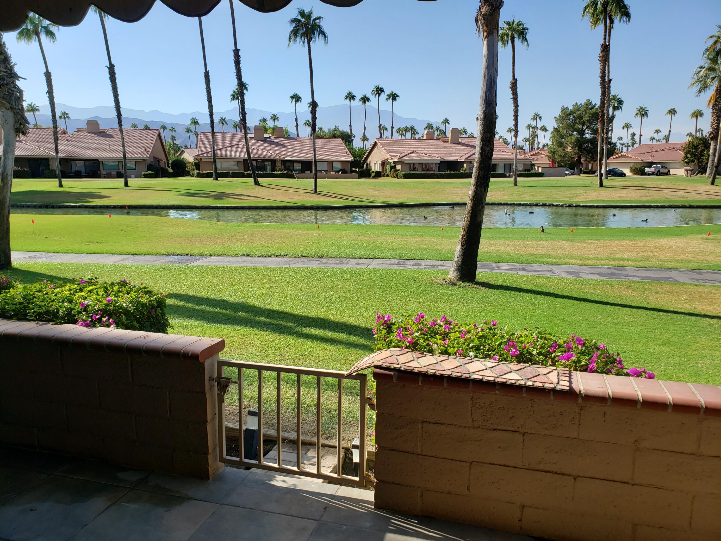 a view of a lake with a sitting area