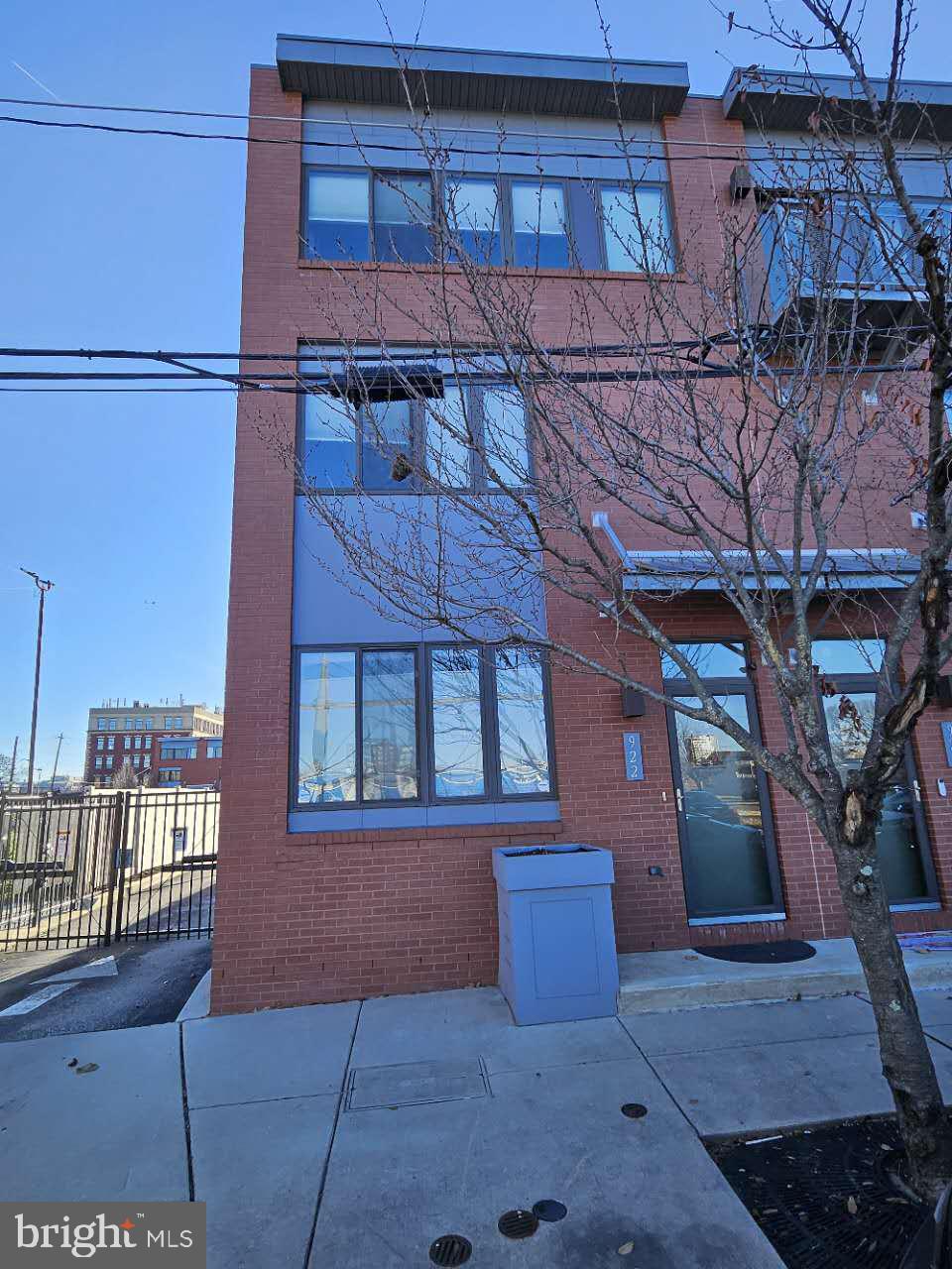 a view of a brick house with many windows