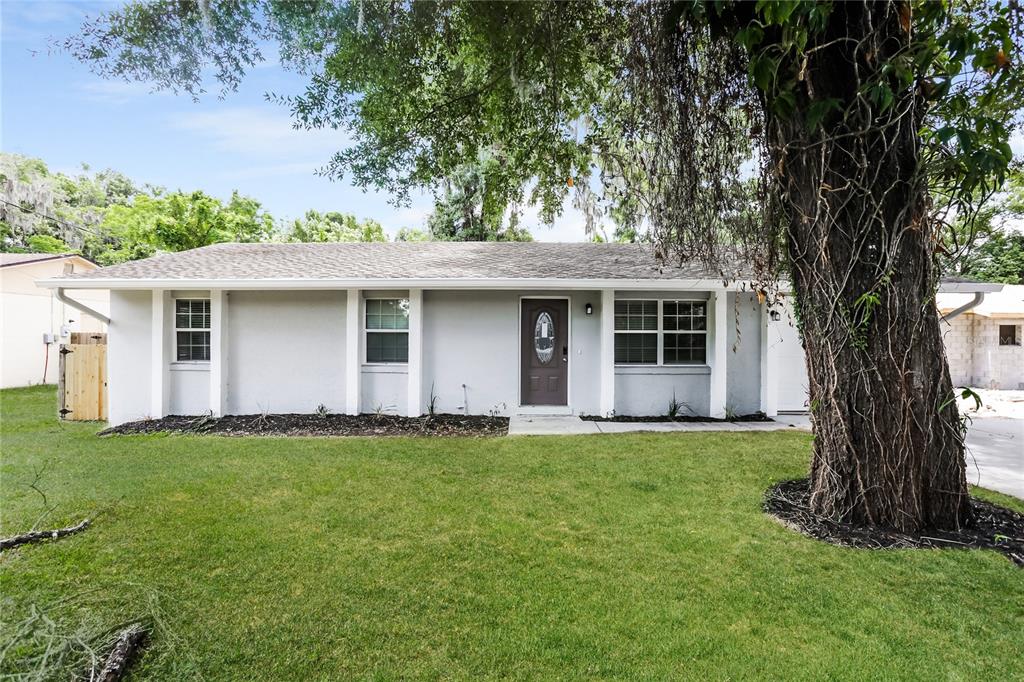 front view of a house with a yard