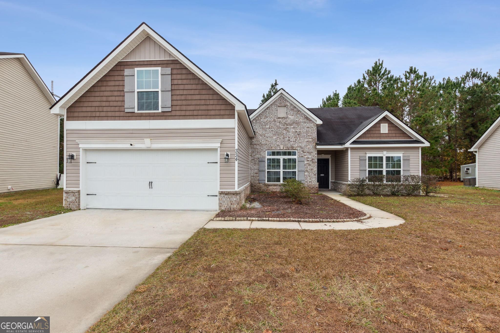 a front view of a house with a yard