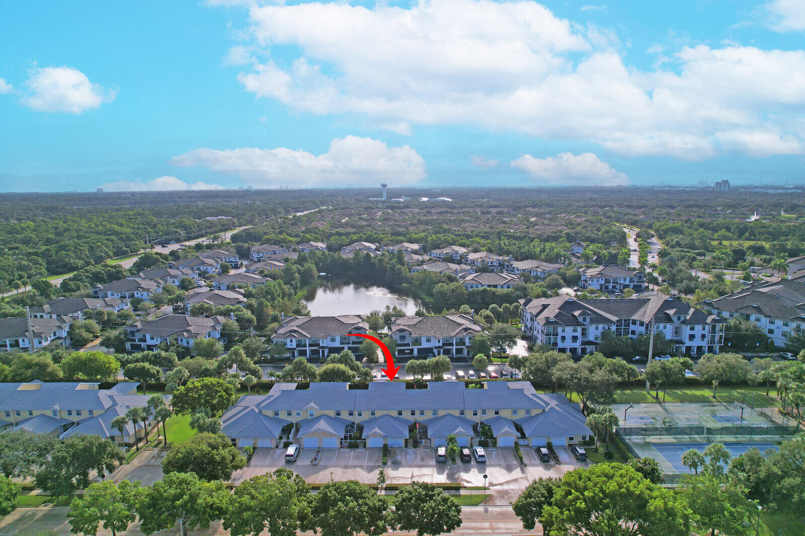 an aerial view of house with yard and mountain view in back