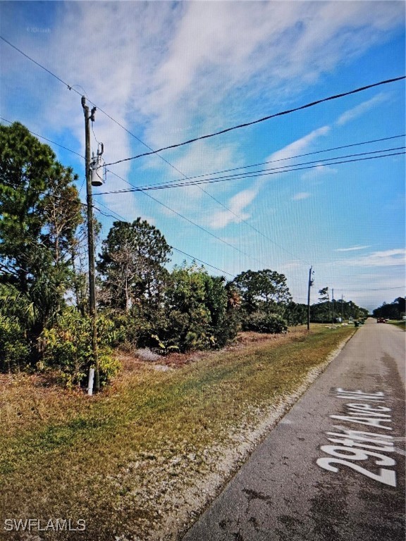 a view of a road with an ocean view