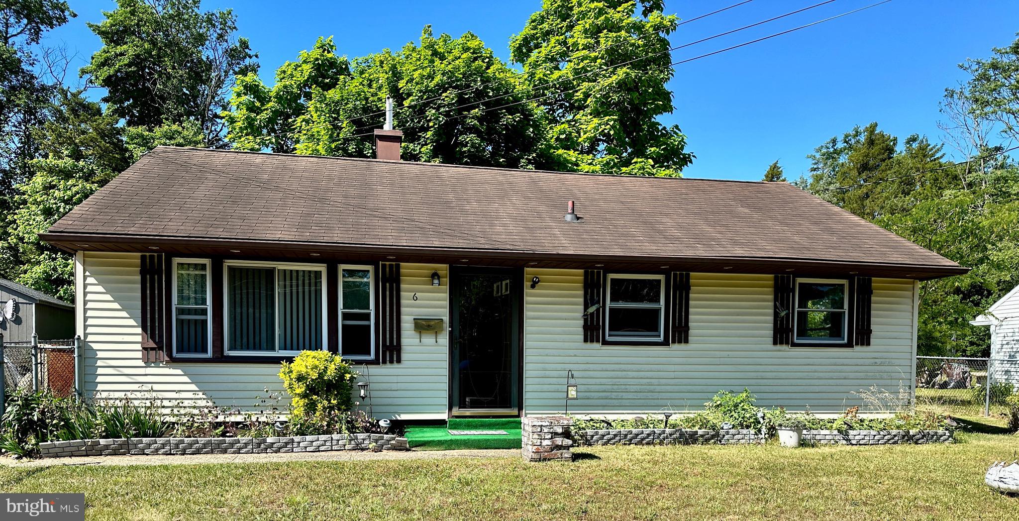 front view of a house with a yard