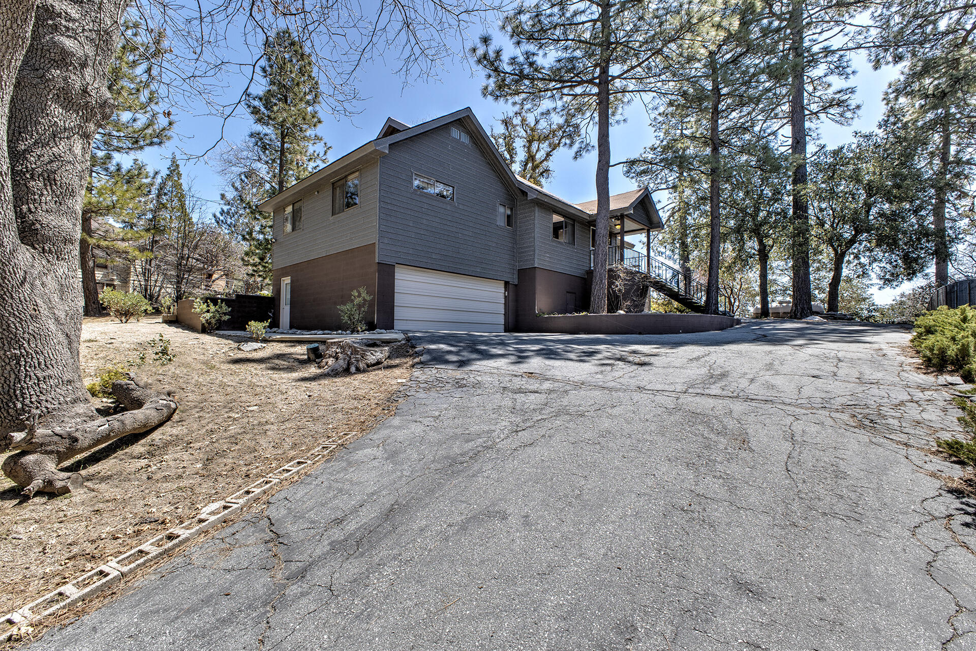 a view of the house with snow on the road