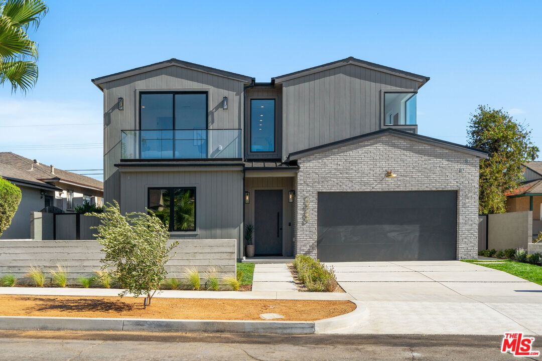 a front view of a house with garage