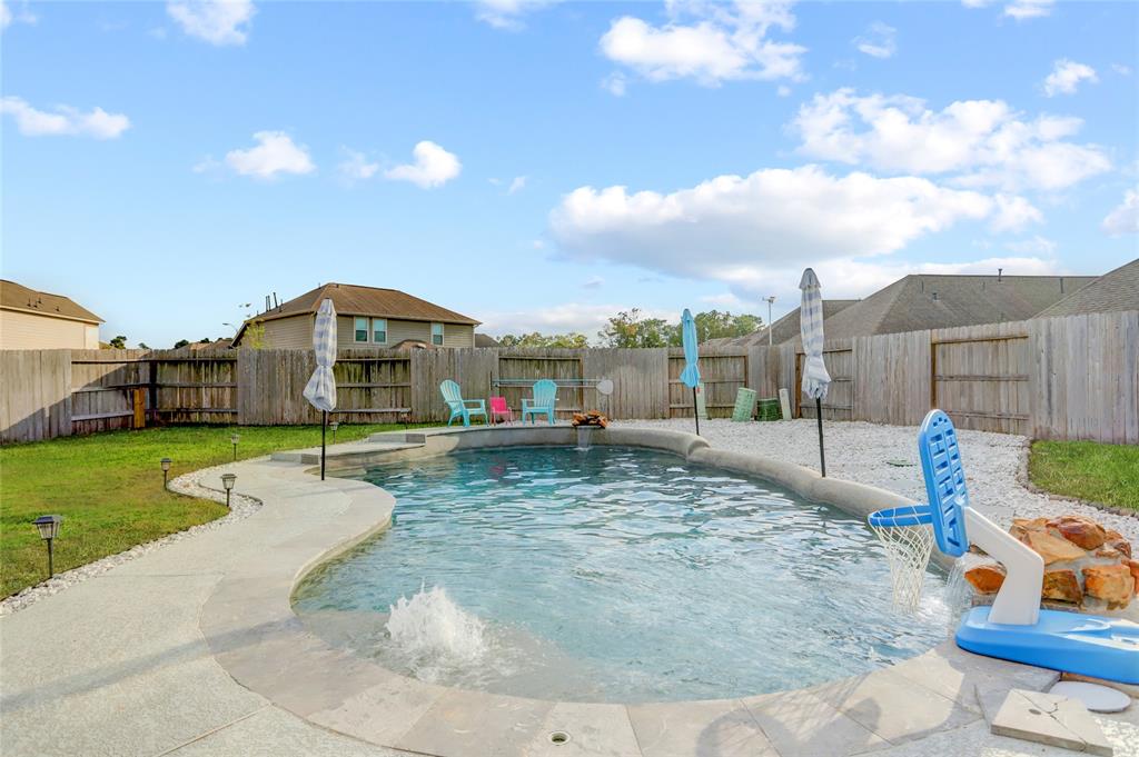 a view of a house with a backyard porch and sitting area