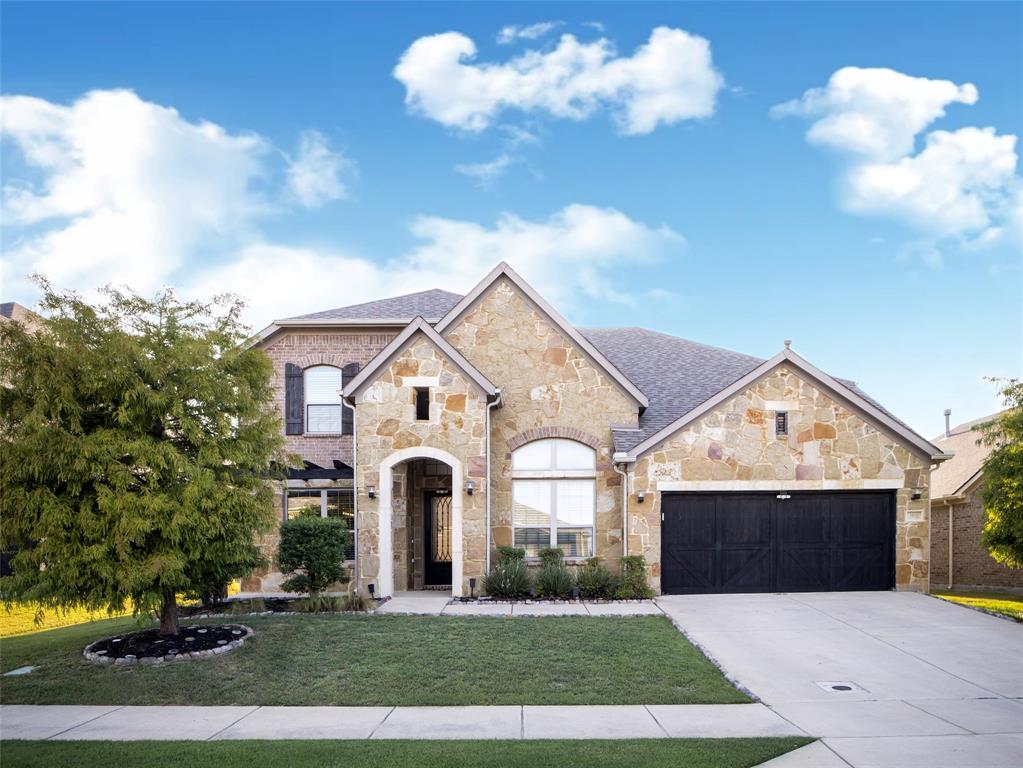 a view of house with yard and entertaining space