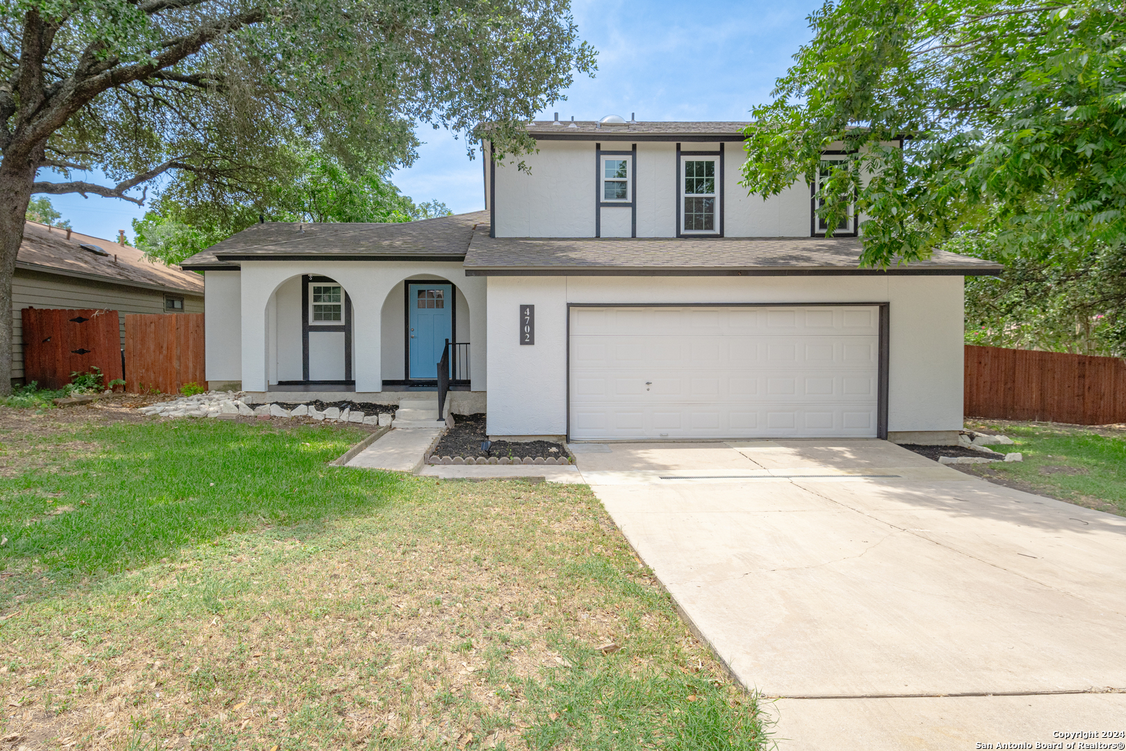 front view of a house with a yard