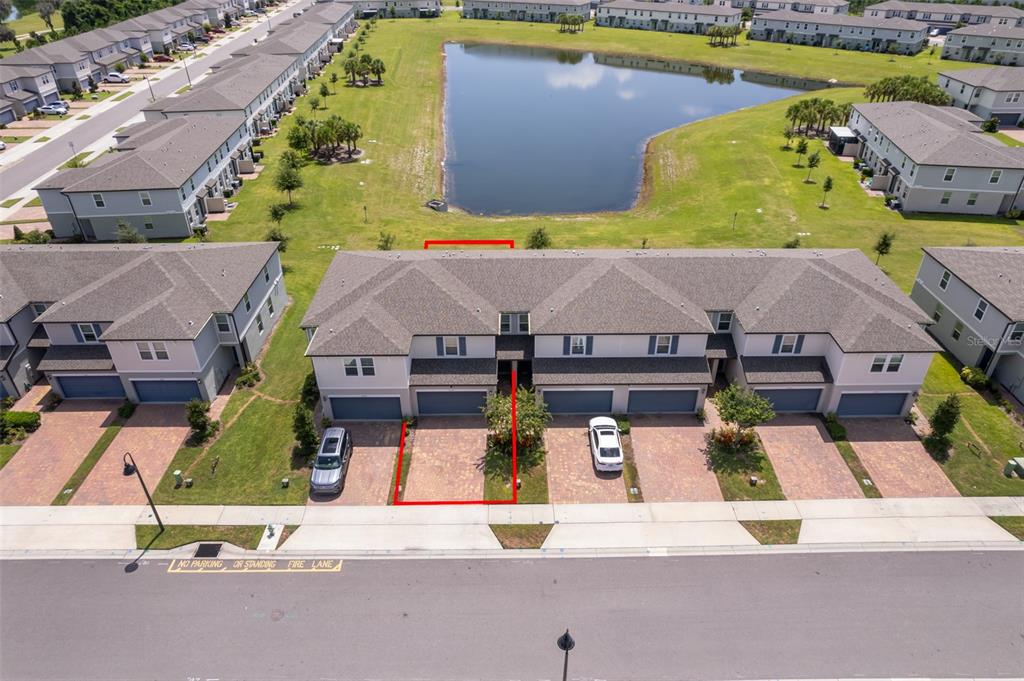 an aerial view of a house with swimming pool