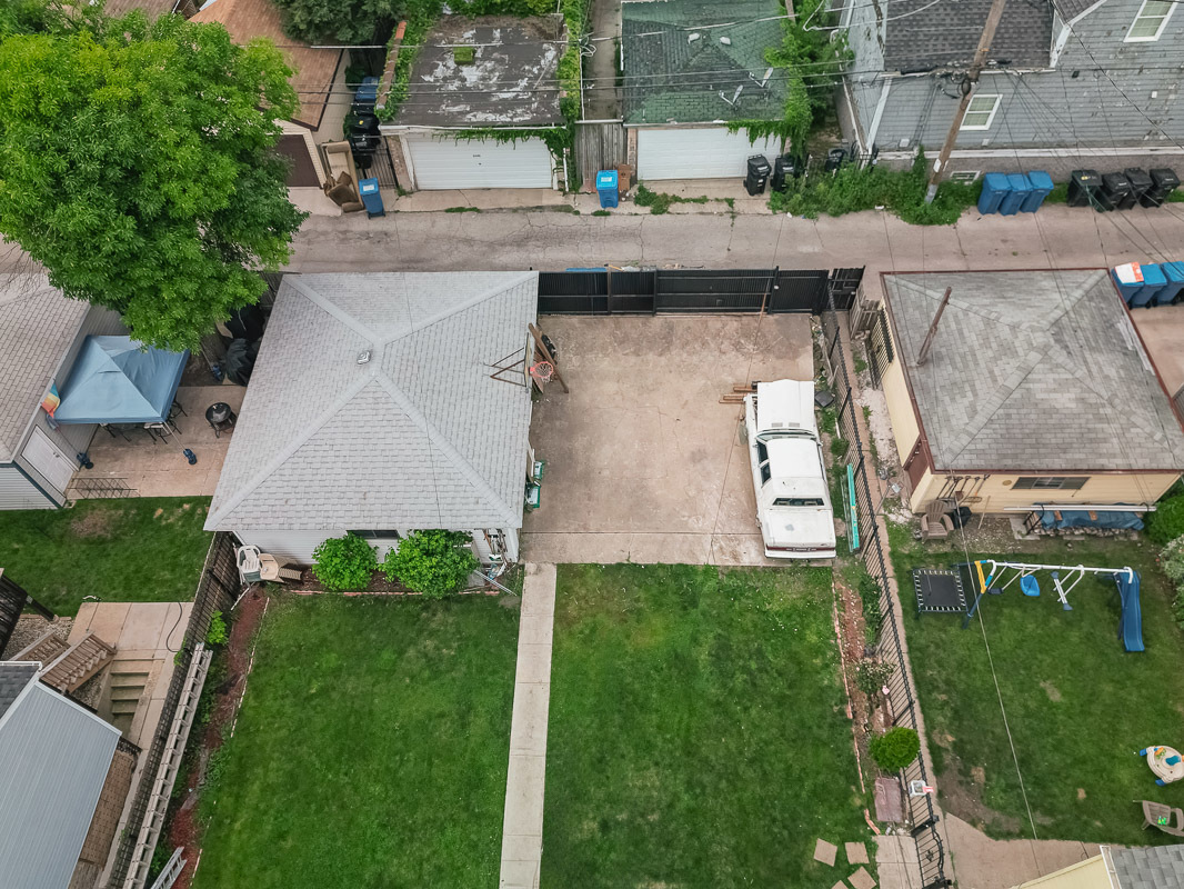 an aerial view of a house with a garden