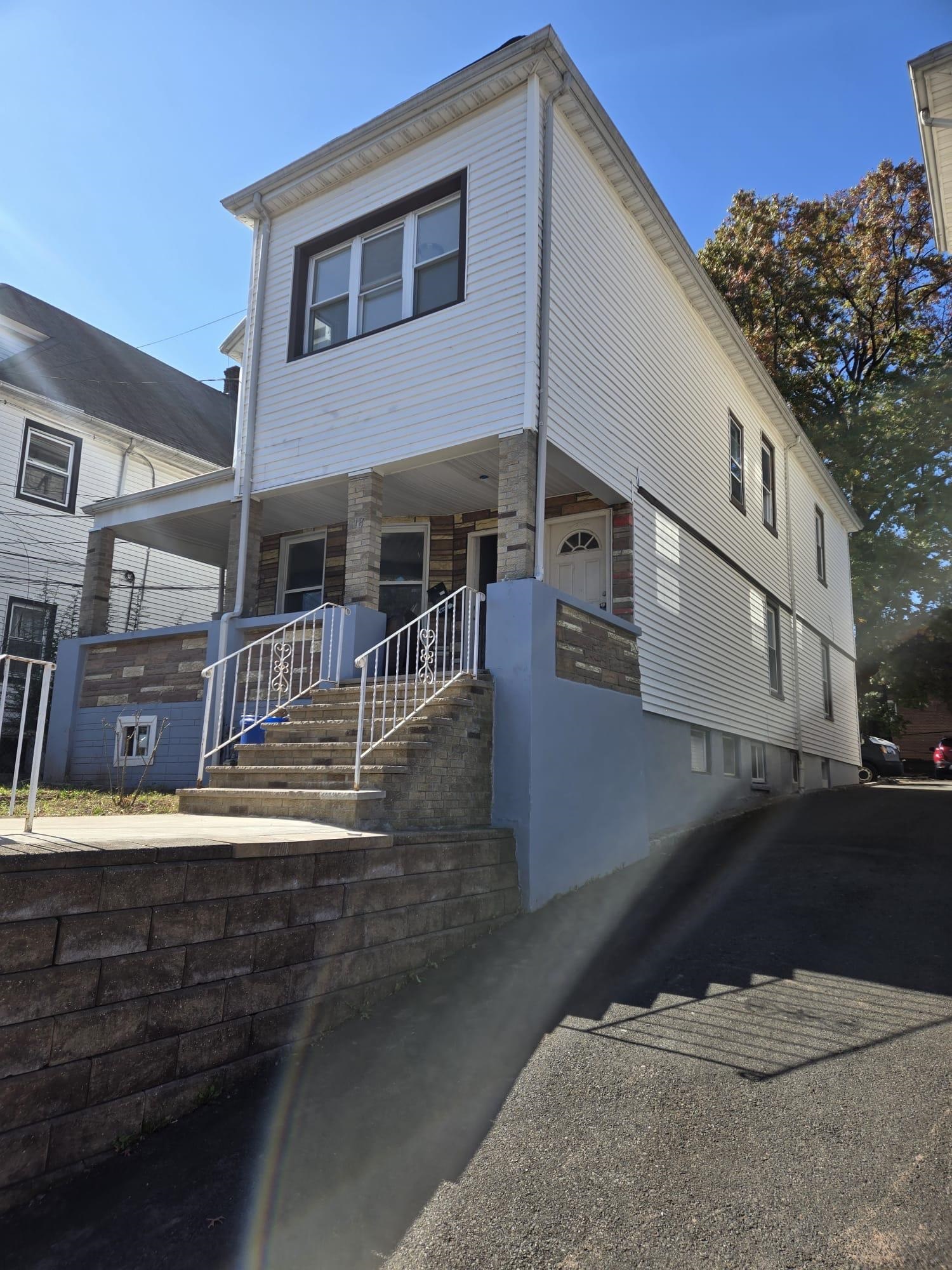 a view of a house with a street