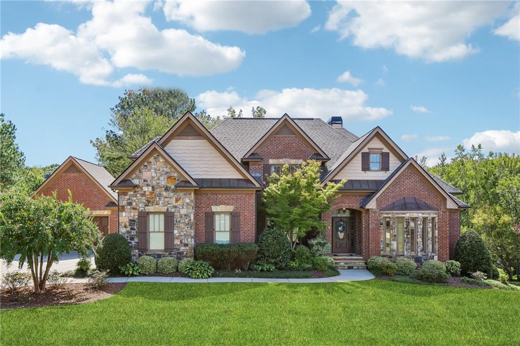 a front view of a house with a yard