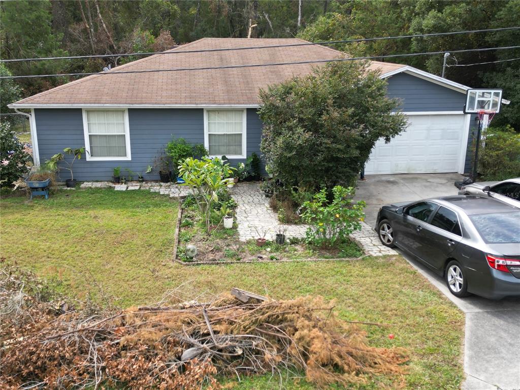 a house view with a garden space