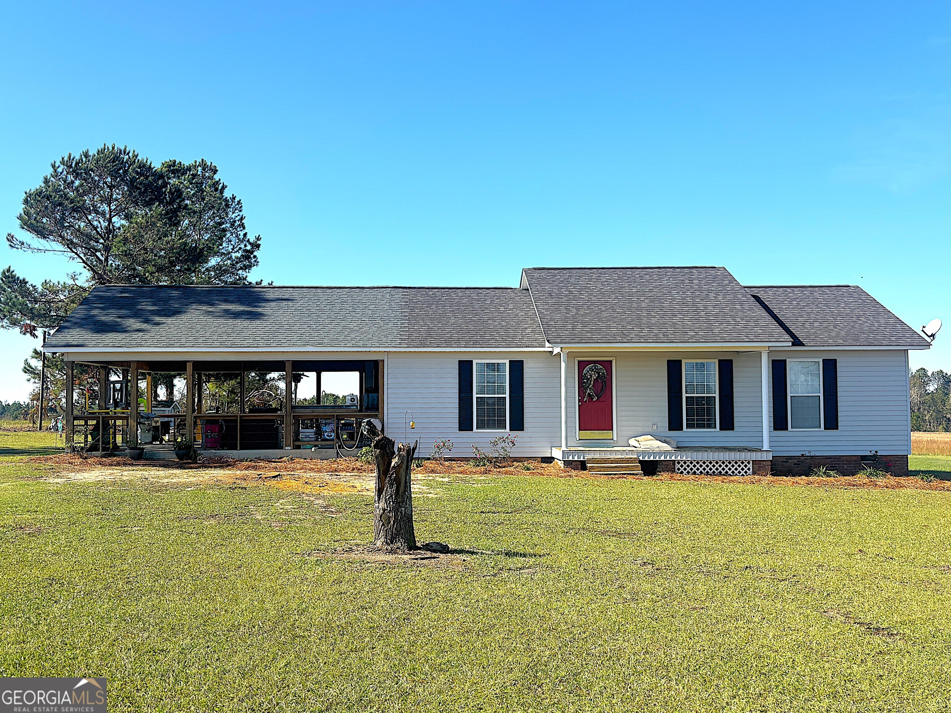 a front view of house with yard and porch