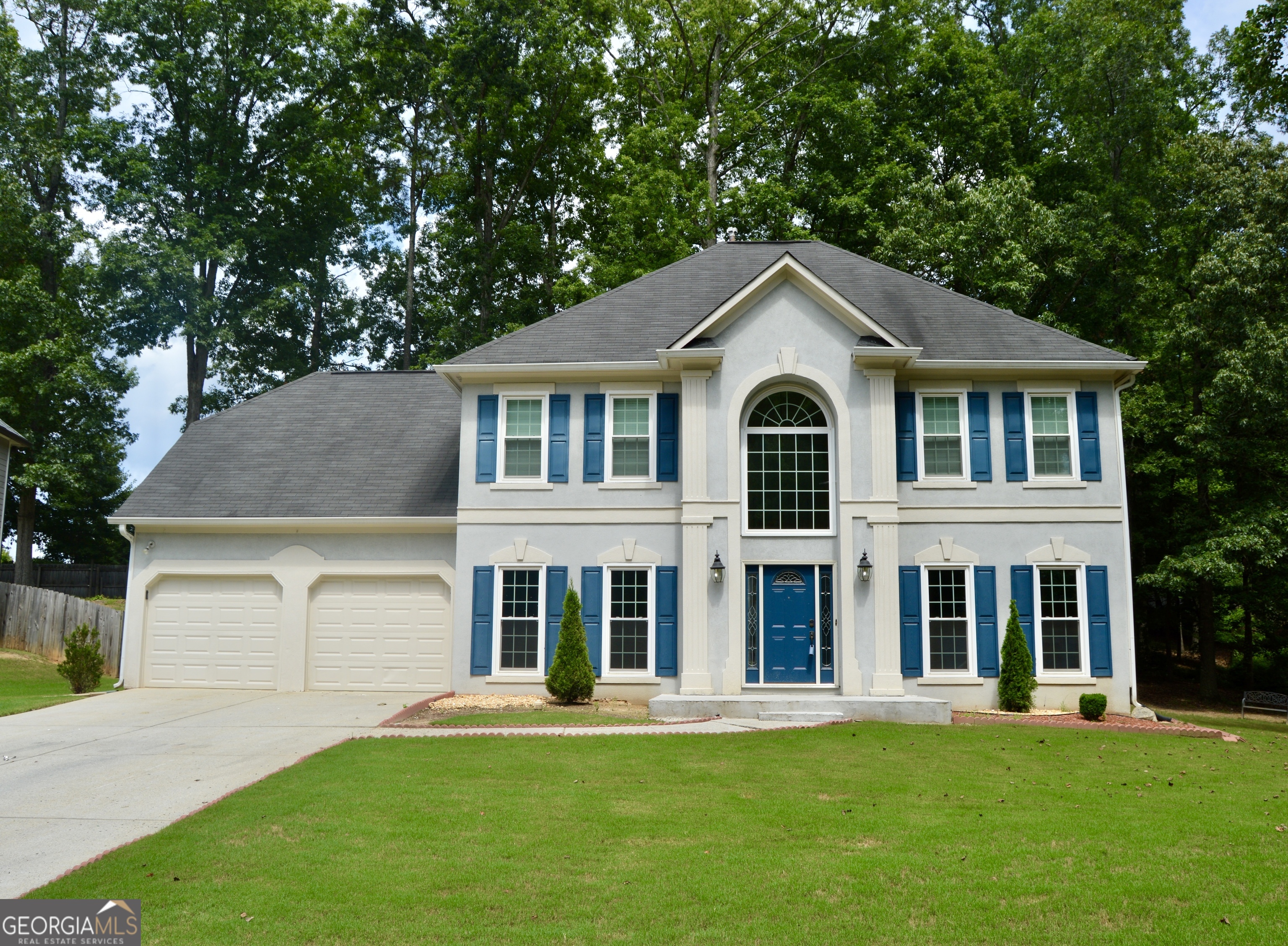 front view of a house with a yard