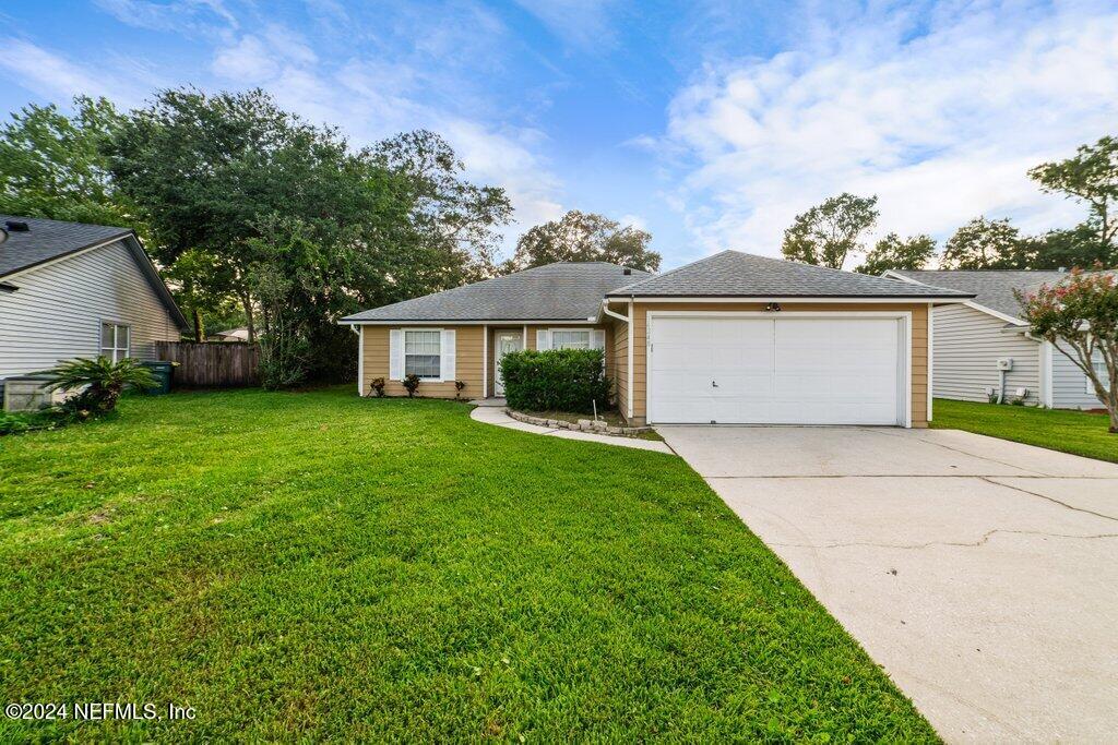 a view of a house with a yard