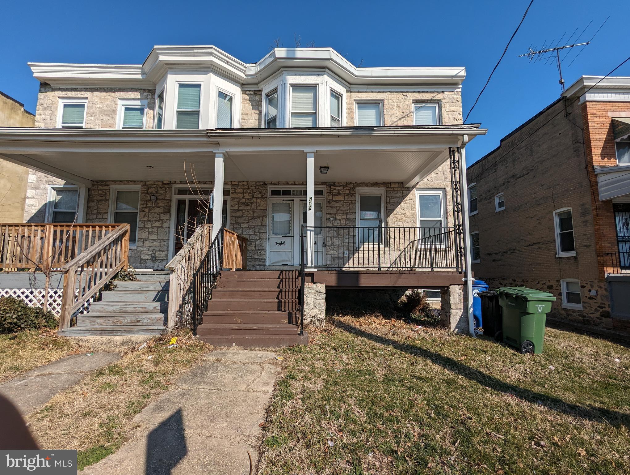 a view of a house with a wooden deck