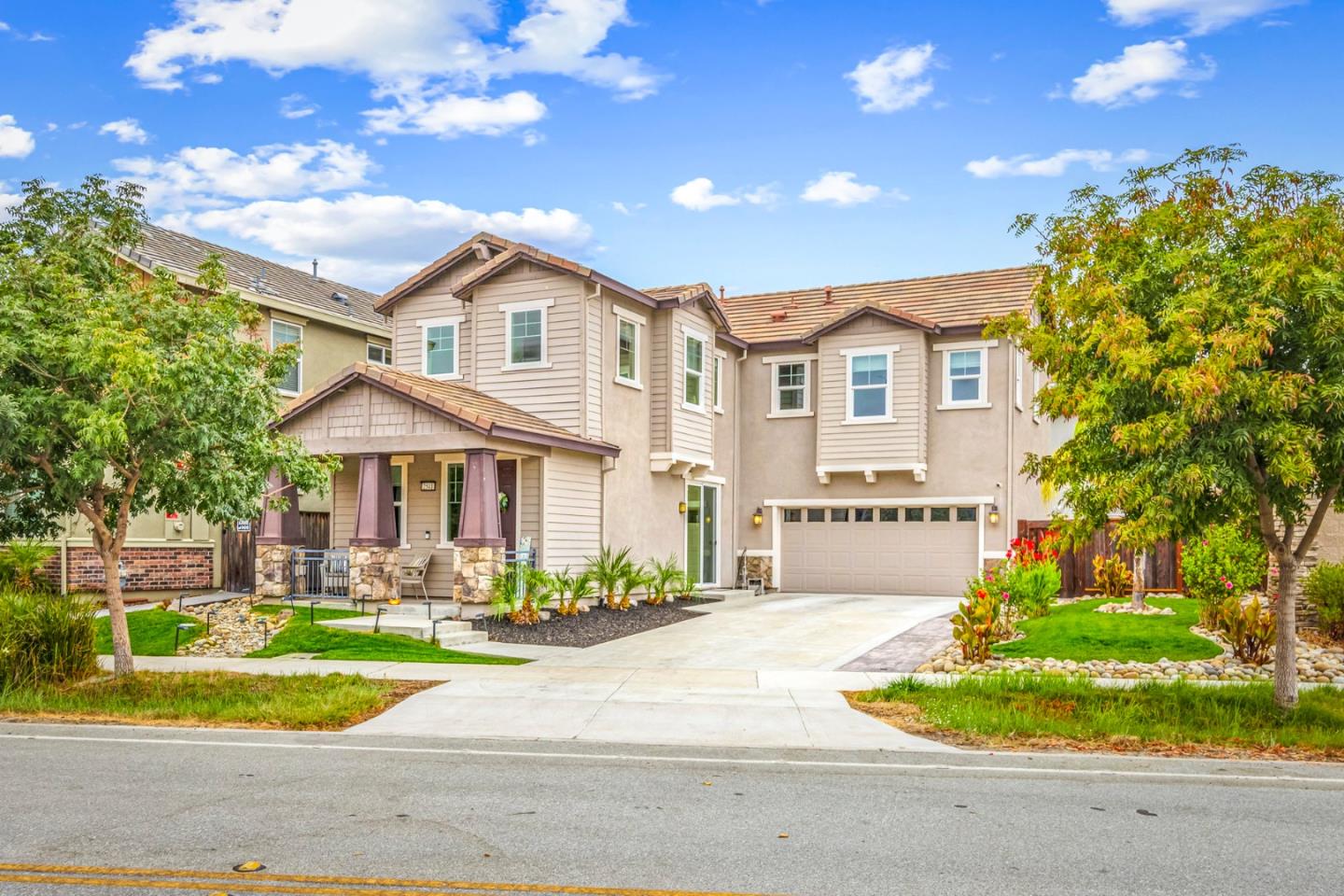 a front view of a house with a yard