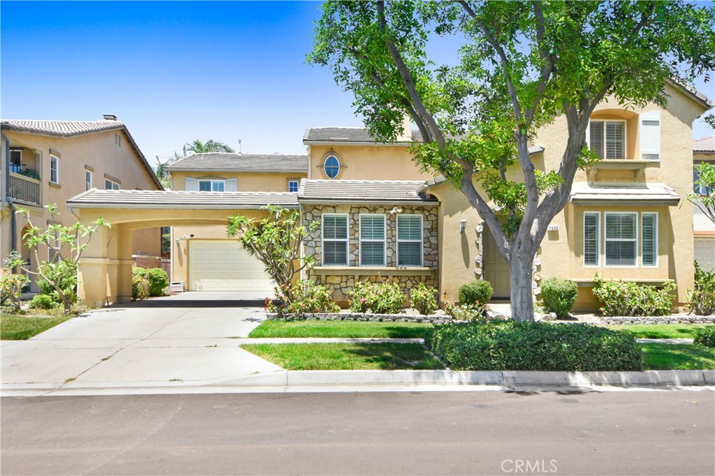 front view of a house with a yard